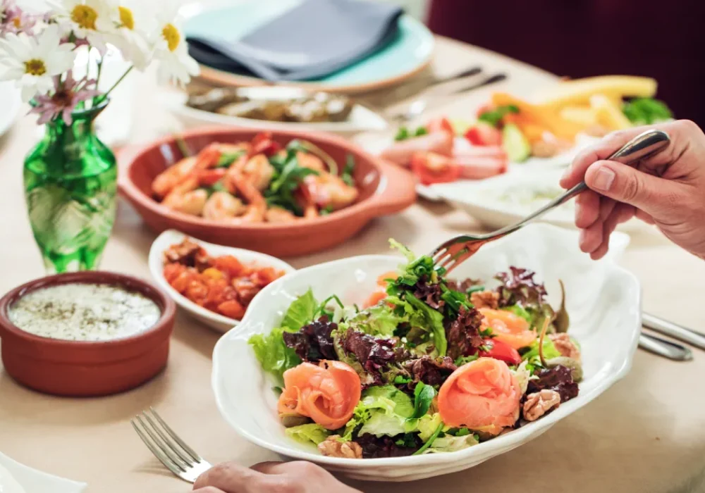 taking-green-salad-from-white-bowl-with-fork taking-green-salad-from-white-bowl-with-fork